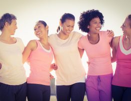 Laughing women wearing pink for breast cancer in parkland