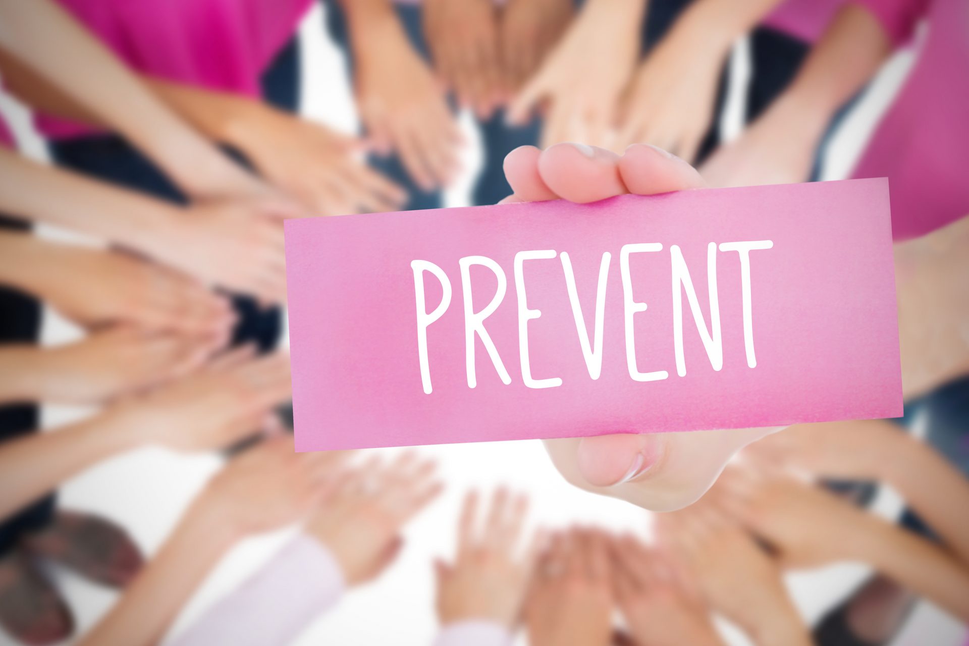 The word prevent and young woman holding blank card against oktoberfest graphics