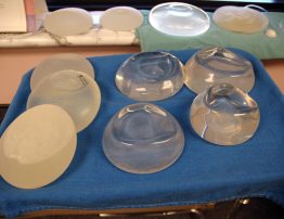 various breast implants as samples on a tray in  a doctors office